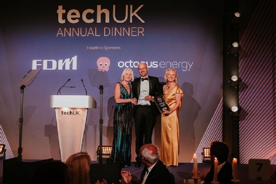 Chris Field, chief marketing officer at Yoti, accepts the People Award on behalf of Yoti CEO Robin Tombs, from TechUK president Sheila Flavell and deputy president Nicola Hodson