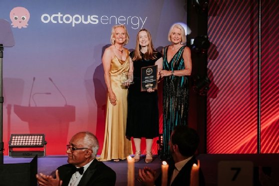 Isobel Ashbey, sustainable technology consultant at Cambridge Consultants, accepts the Planet Award from TechUK president Sheila Flavell and deputy president Nicola Hodson