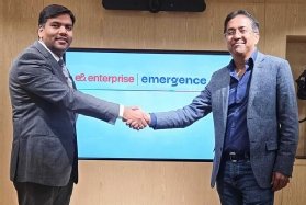 Photo of Amit Gupta, vice-president and head of data, AI and Fintech at e& enterprise, and Satya Nitta, CEO and co-founder of Emergence AI, shaking hands